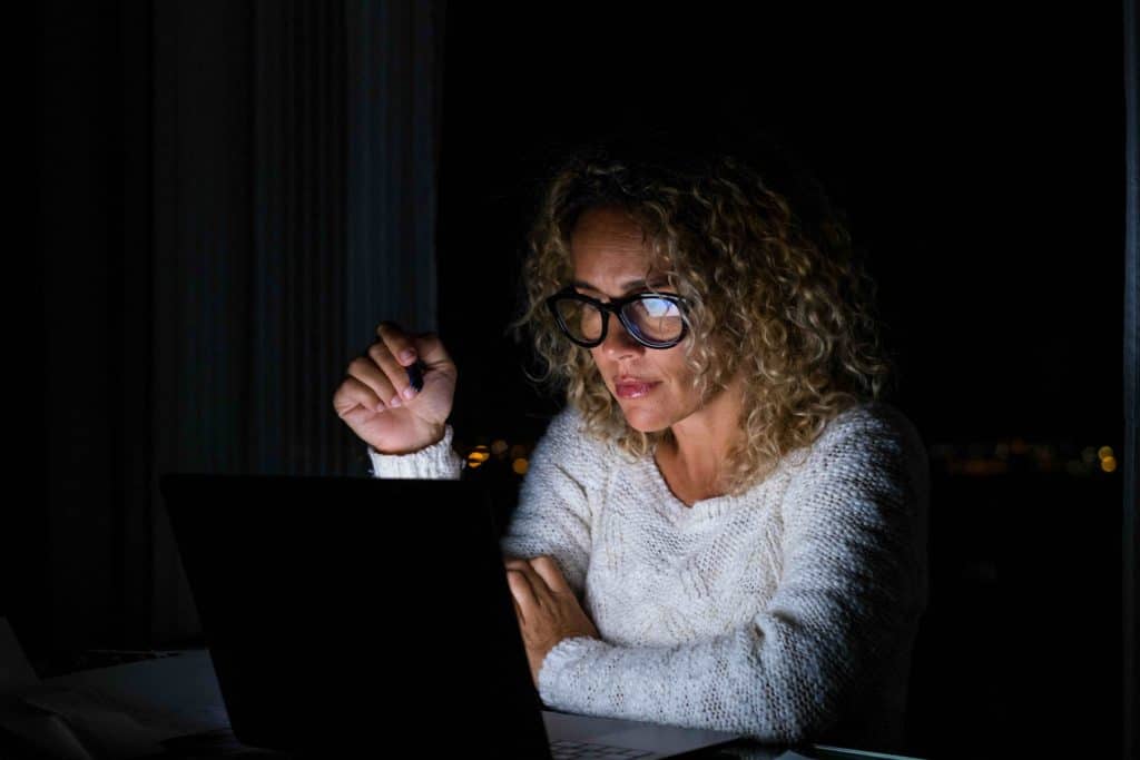 Woman working late on laptop