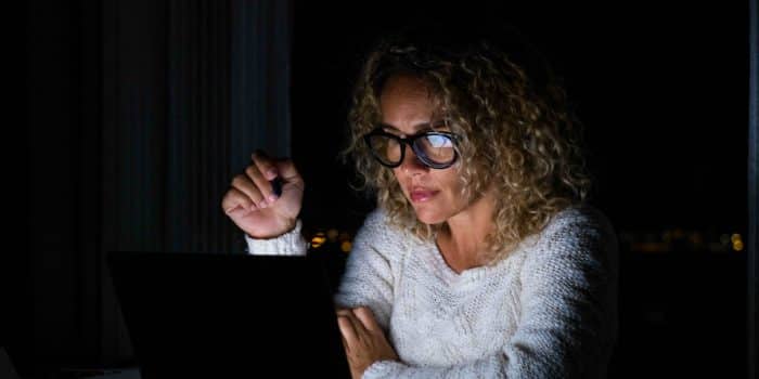 Woman working late on laptop