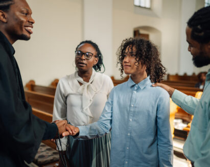 Pastor Greeting a Guest After Service