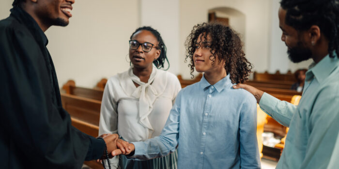 Pastor Greeting a Guest After Service