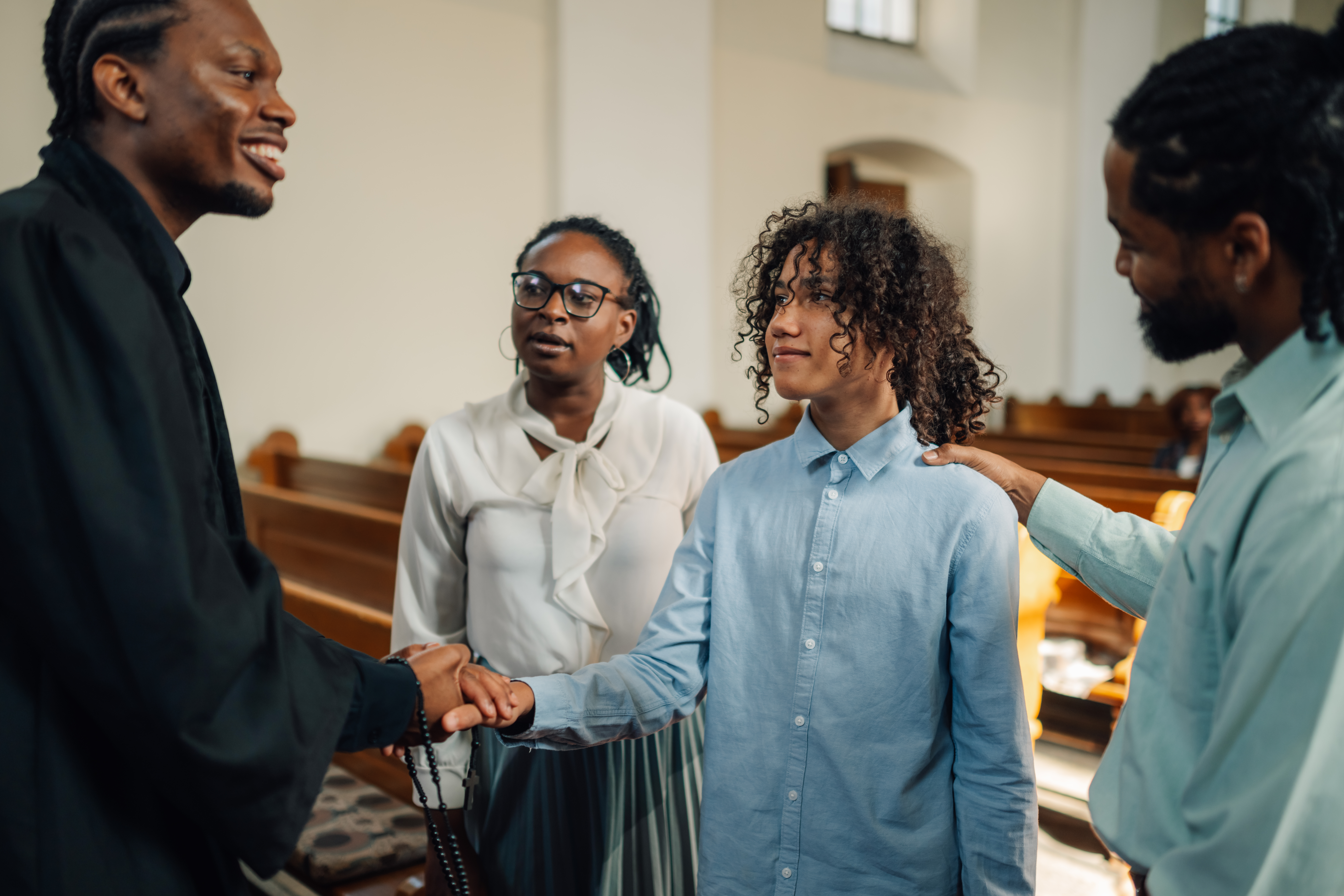 Pastor Greeting a Guest After Service